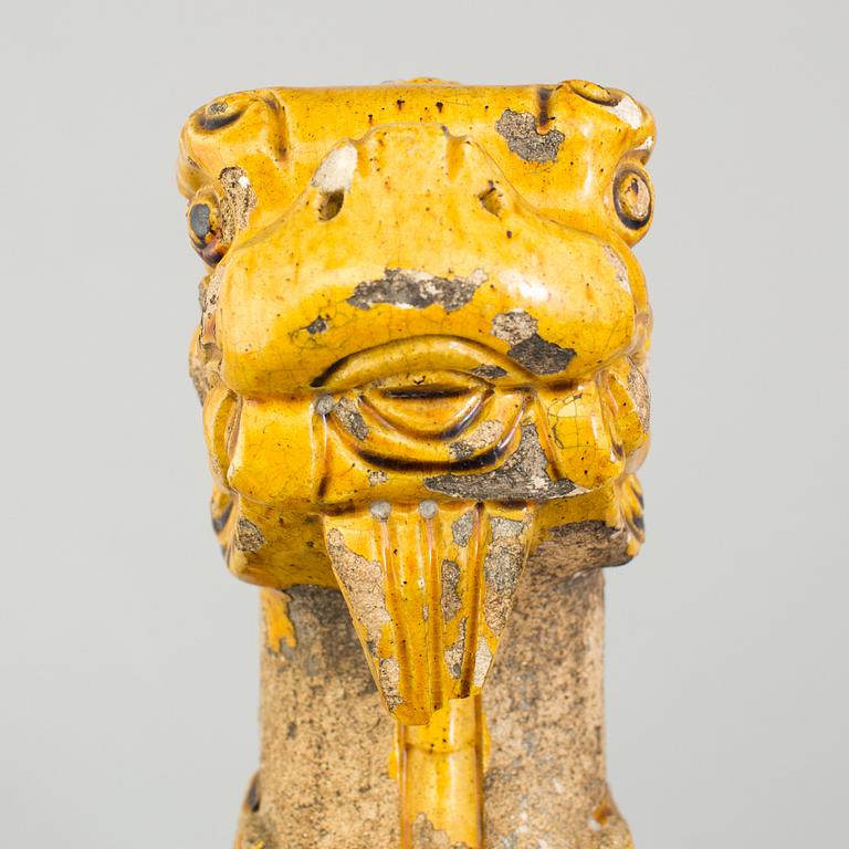A yellow glazed fragment of a rooftile, Ming dynasty (1368-1644).