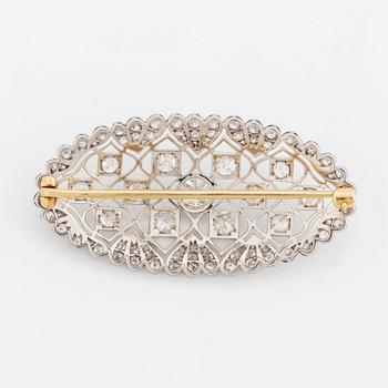 A platinum and gold brooch set with old-cut diamonds.
