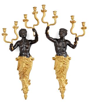 A pair of Louis Philippe 1830/1840's gilt and patinated bronze four-light wall-lights.