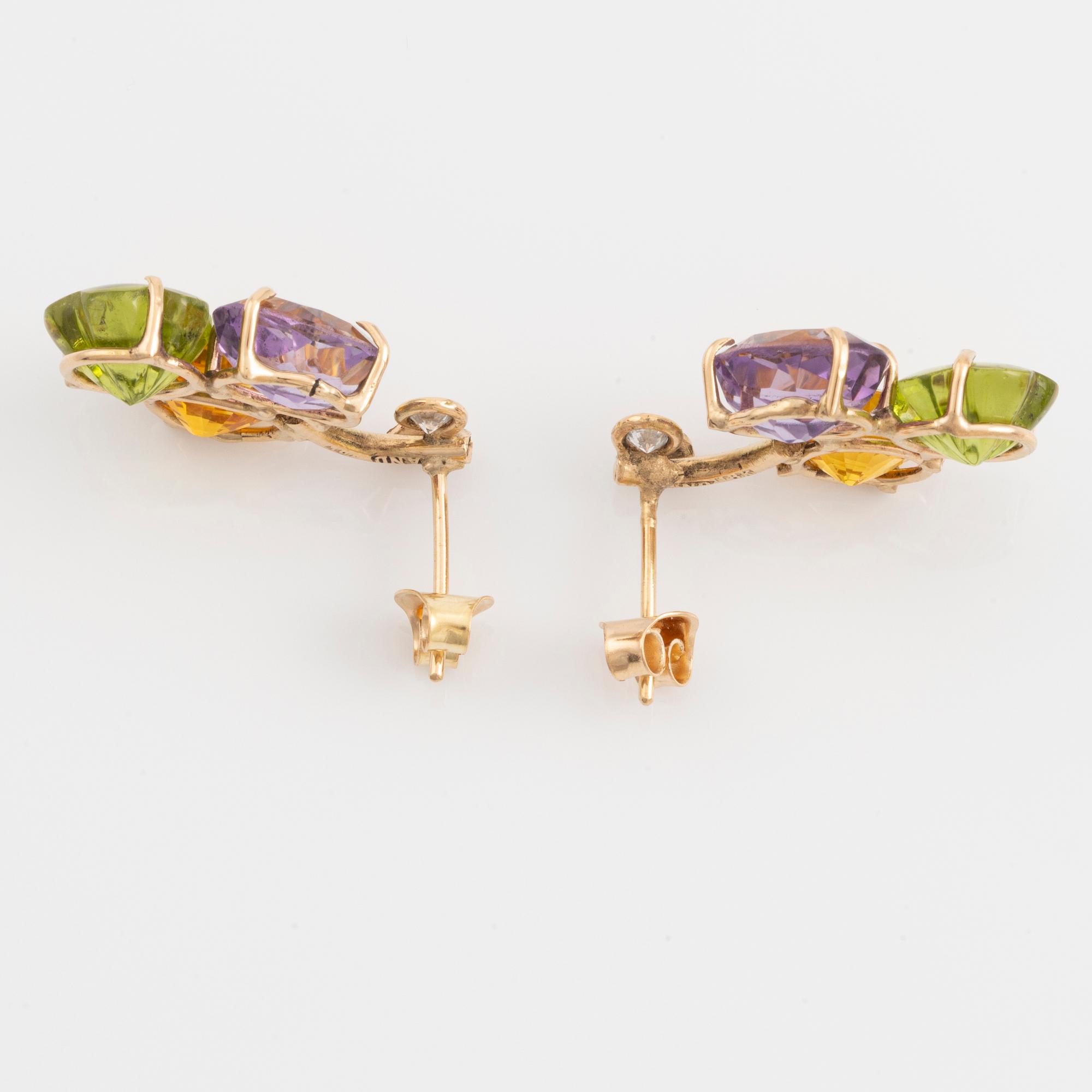 Earrings with yellow sapphires, cut flower-shaped peridot, amethyst, and brilliant-cut diamonds.