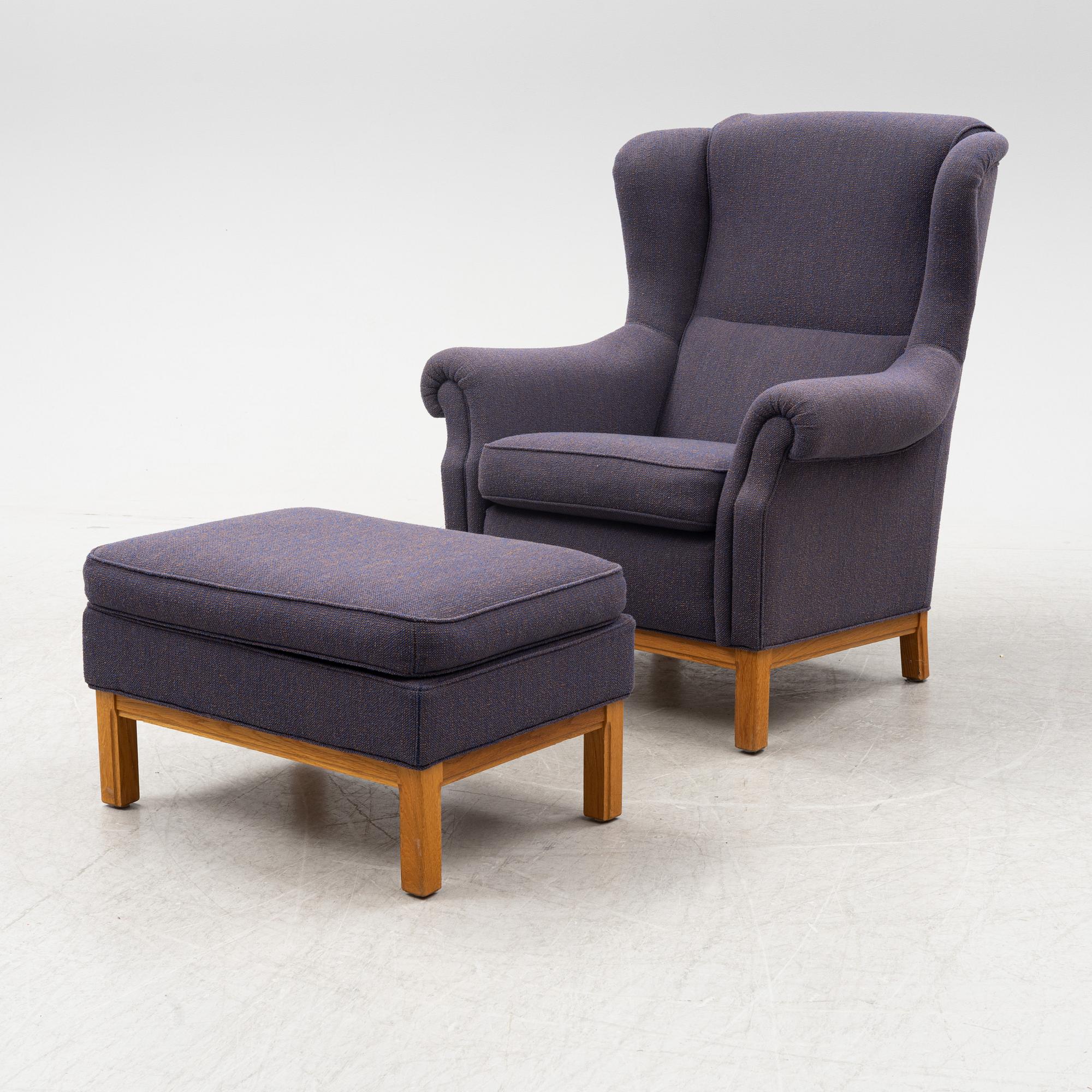 An armchair with foot stool, Norell Möbler AB, Sweden, late 20th century.