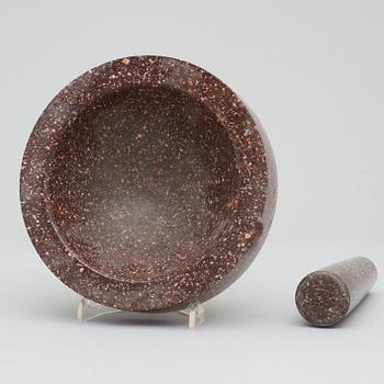 A Swedish porphyry mortar with pestel.