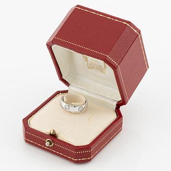 Cartier "Love" ring in 18K white gold with round brilliant-cut diamonds.