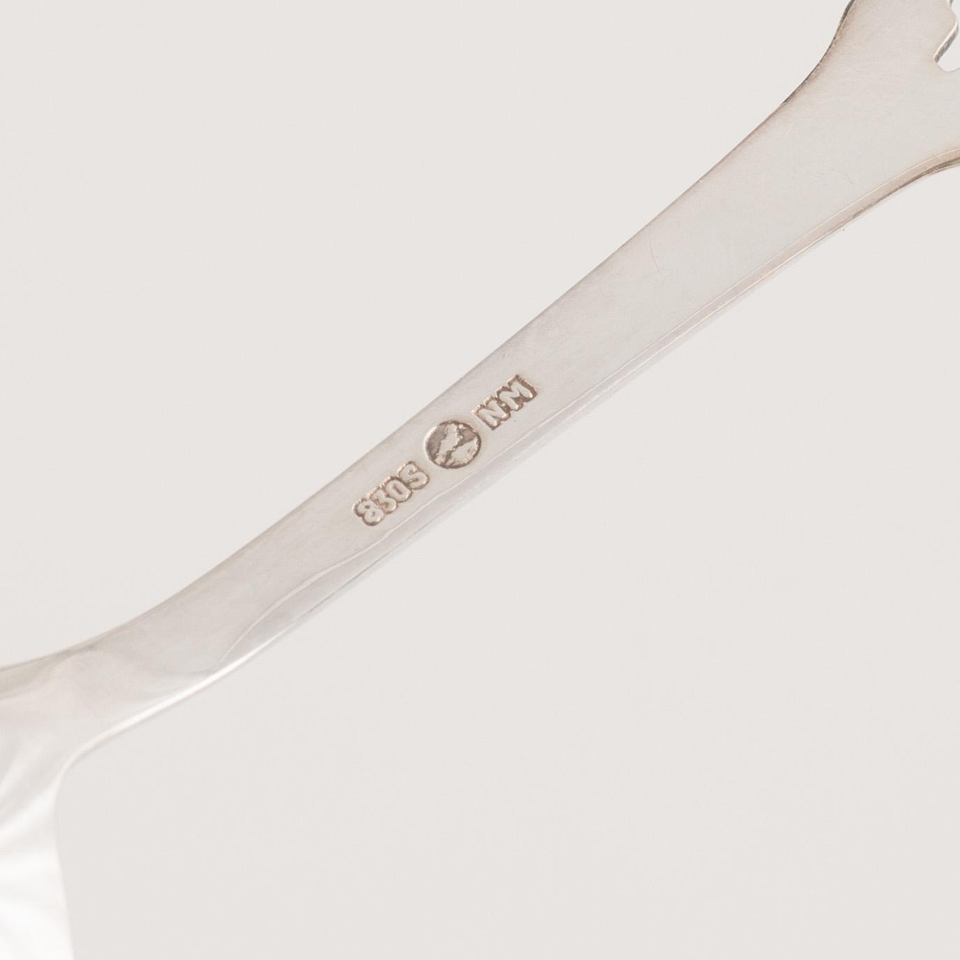 A 37-piece set of dessert cutlery, mostly the same model, with Swedish import marks.