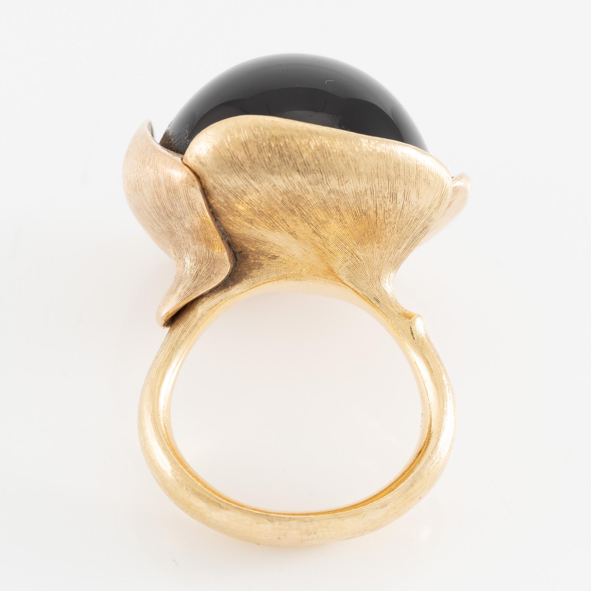 Ole Lynggaard, ring, large Lotus, 18K gold with cabochon-cut black stone probably onyx with brilliant-cut diamonds.