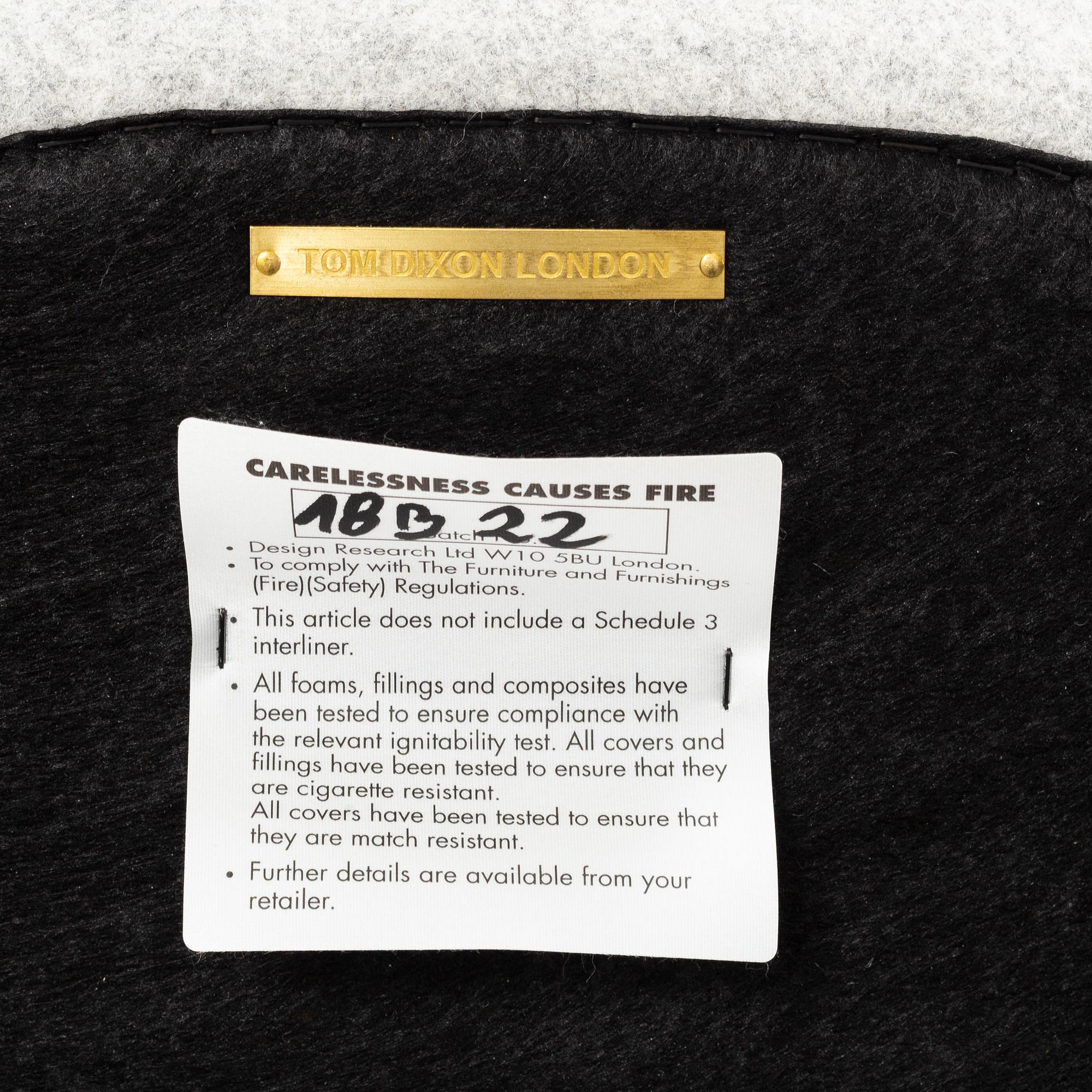 A 'Wingback Micro' easy chair by Tom Dixon.