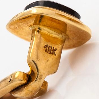 A pair of cufflinks and three shirt buttons,  18K gold and onyx.