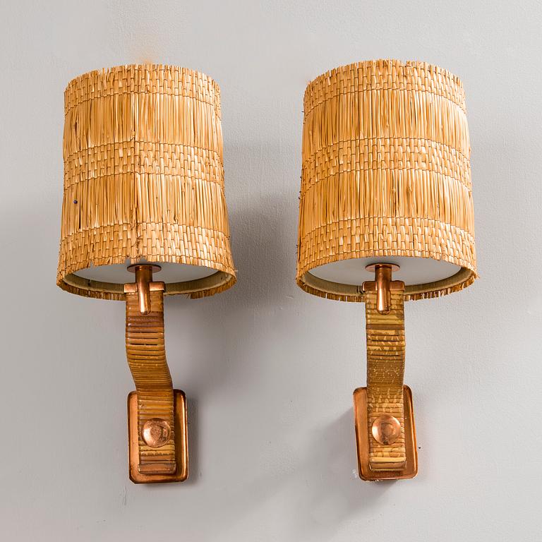 PAAVO TYNELL, A PAIR OF WALL LAMPS. Marked Taito. 1940-1950s.