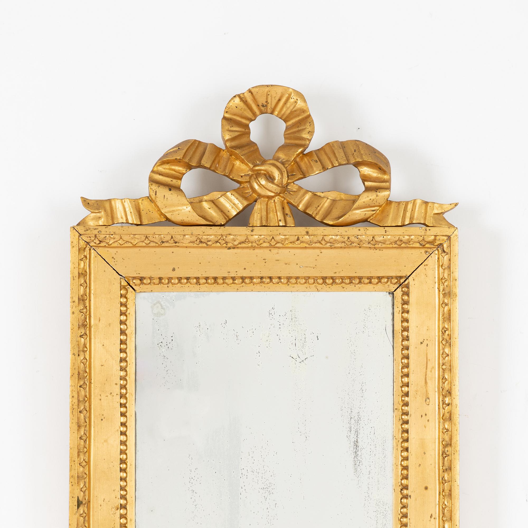 A Gustavian style mirror, first half of the 20th Century.