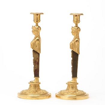 A pair of Empire circa 1810 candlesticks.