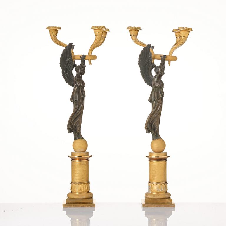 A pair of Empire ormolu and patinated bronze three-branch candelabra, possibly by R. F. Lindroth (1813-17).