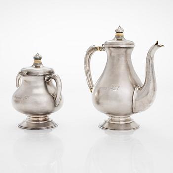 A four-piece silver coffee set, St. Petersburg 1887, original fitted box from Khlebnikov. Sugar tong, Moscow around 190.