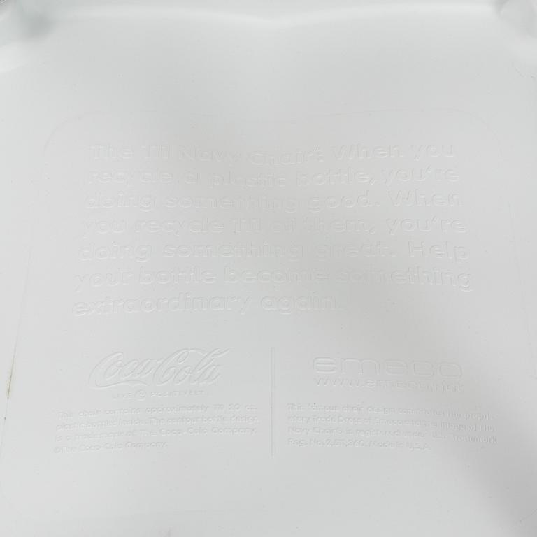 A pair of plastic 'Navy Chair' by Emeco.