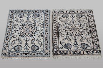 A pair of rugs, Nain, part silk, ca 80 x 60 cm 
 & ca 83 x 58 cm.