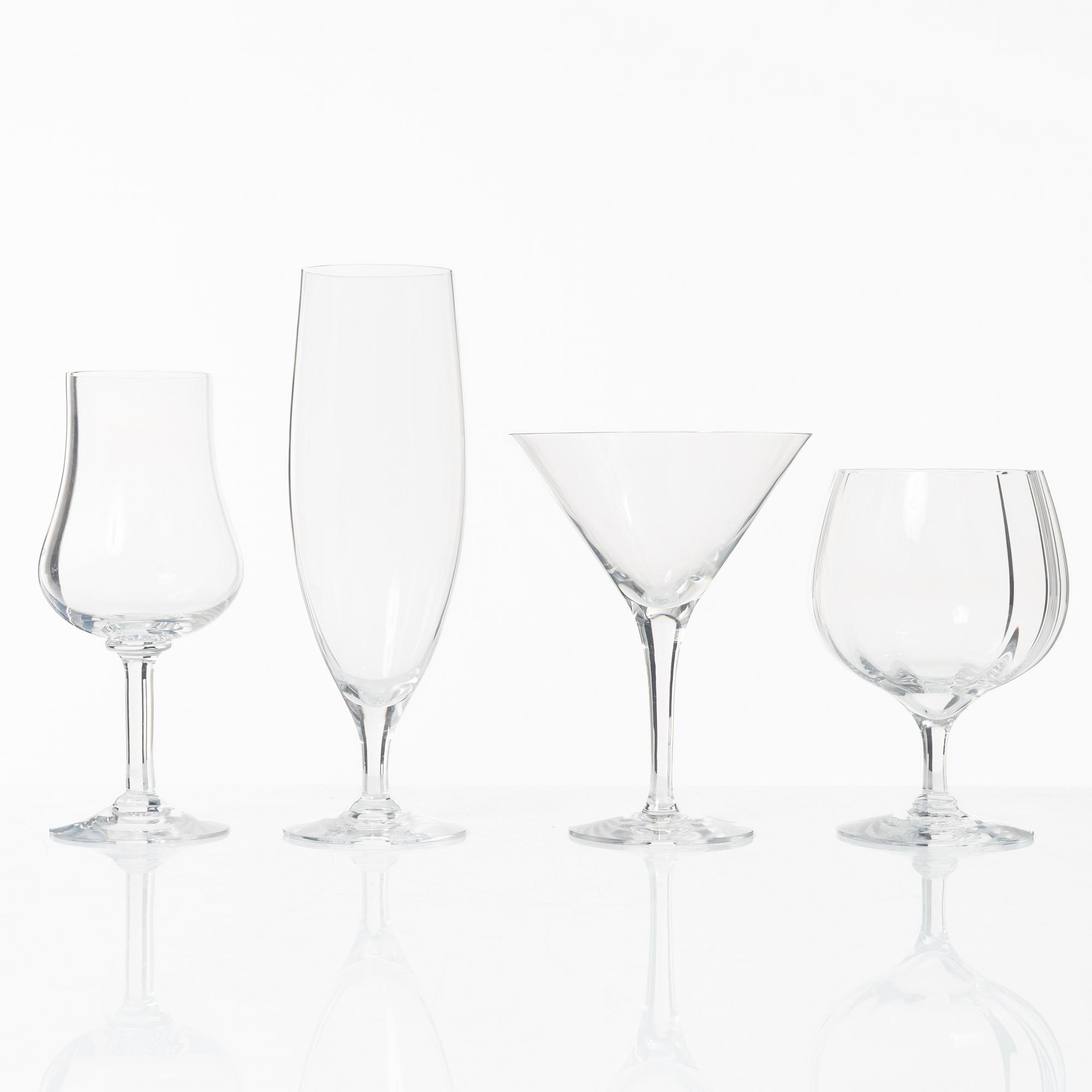 A set of 46 glass service parts, including 'Elixir Connoisseur' and Gunnar Cyrén, 'Optica', Orrefors.