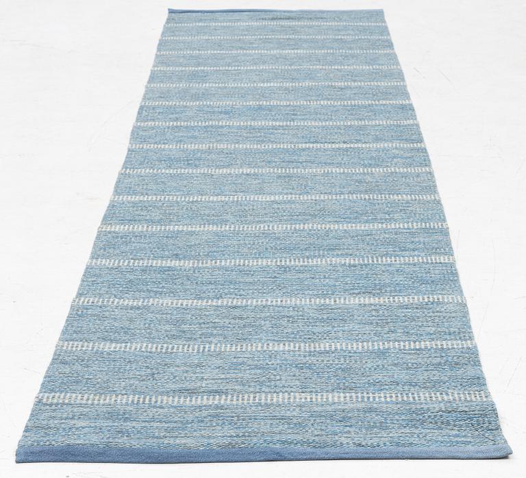 A flat weave runner, mid-20th century, c. 268 x 70 cm.