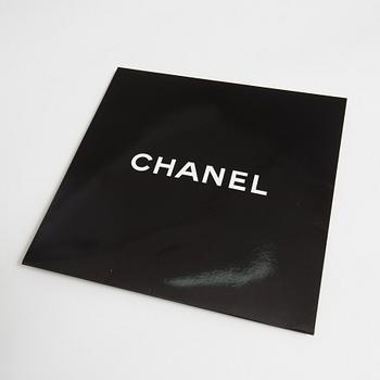 A silk scarf by Chanel.