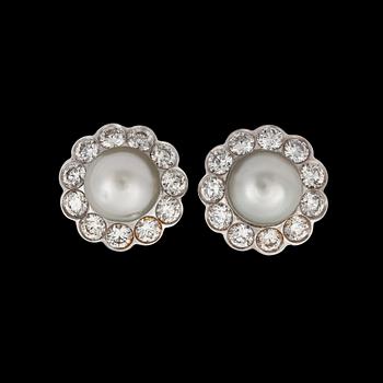 879. A pair of natural saltwater pearl and diamond earrings. Total carat weight of diamonds circa 2.10 cts.
