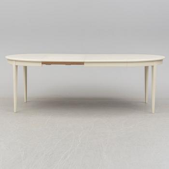 A dining table with six chairs by Carl Malmsten, Bodafors, 1960s.