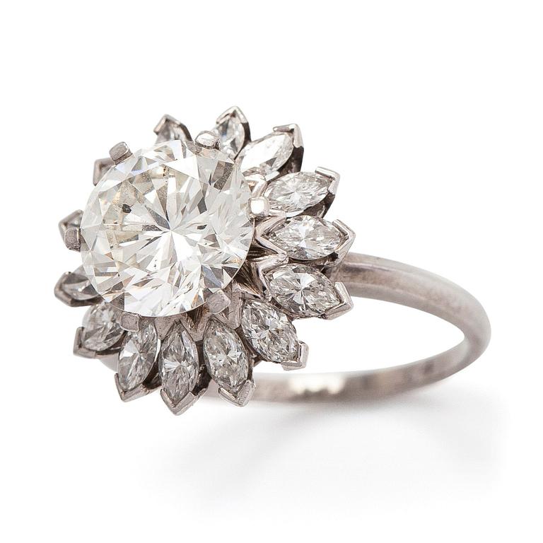 A platinum ring, with a brilliant-cut and marquise-cut diamonds totalling approx. 3.87 ct. With certificate.