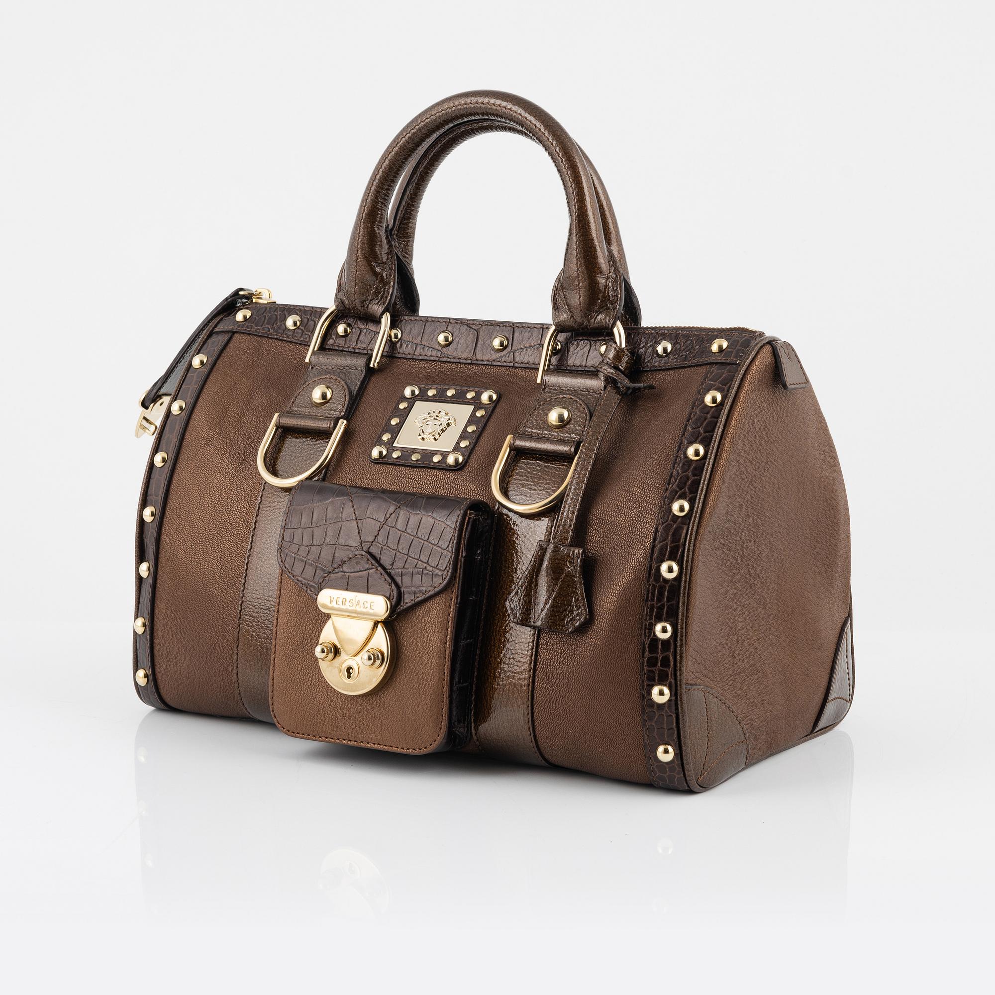 Versace, a bronze metallic leather handbag.