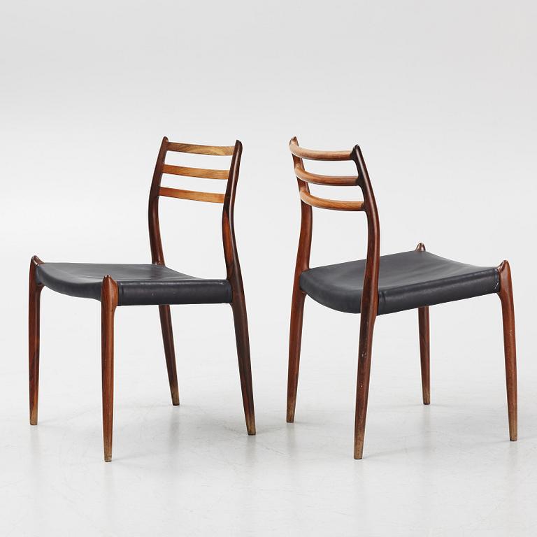 Niles Otto Møller, a rosewood veneered table with four chairs, JL Møller, Denmark, 1950's/60's.