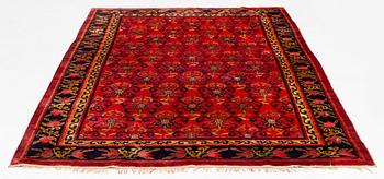 An East Turkestan silk carpet, c. 308 x 182 cm.