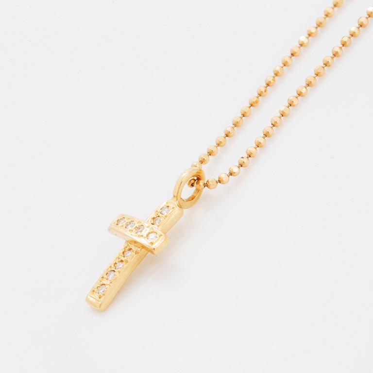 Efva Attling, 18K gold and brilliant-cut diamond cross pendant.