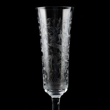 A set of 18 champagne flutes, engraved with animals and leafwork, 20th century Europe .