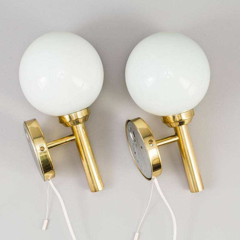 A pair of 20th century brass wall lights by Abo Denmark.