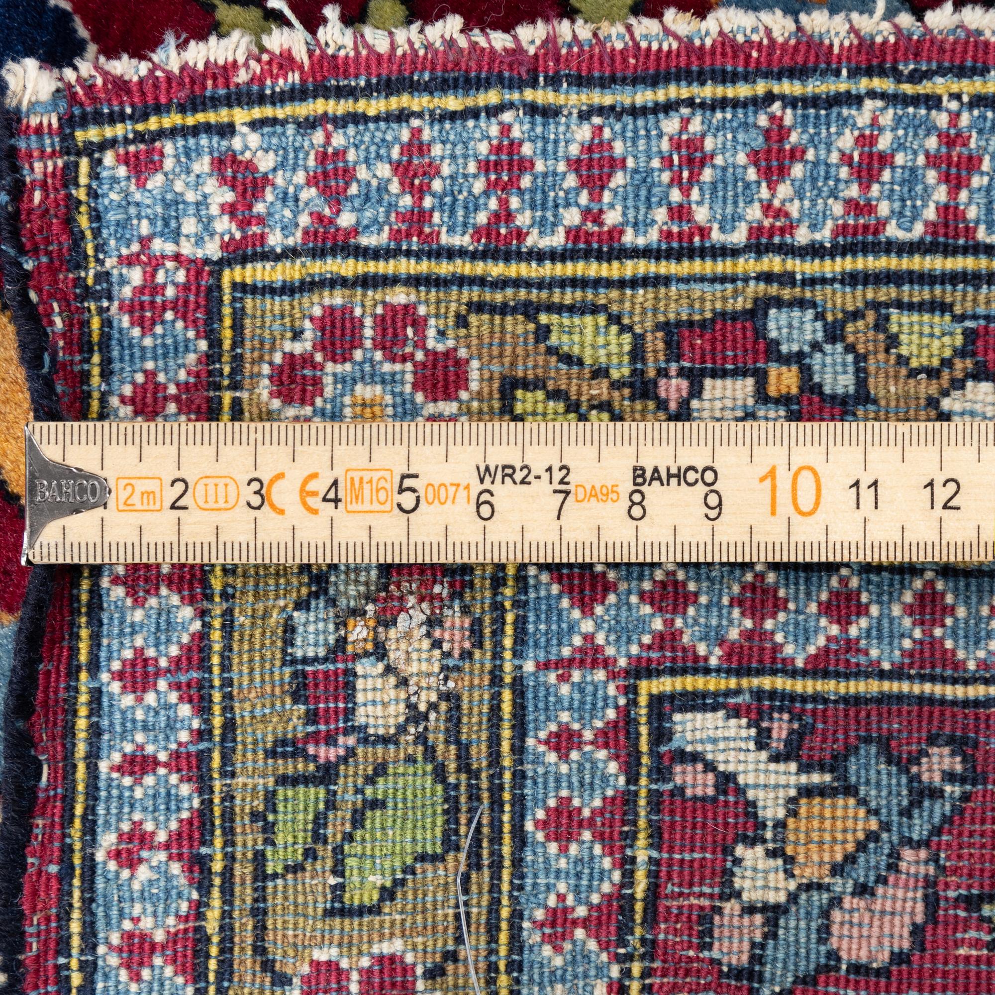 An antique Isfahan rug, Central Persia, c. 219 x 143 cm.