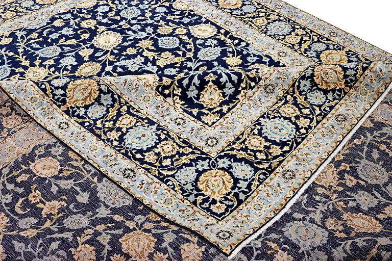 A Kashan carpet, c. 395 x 305 cm.