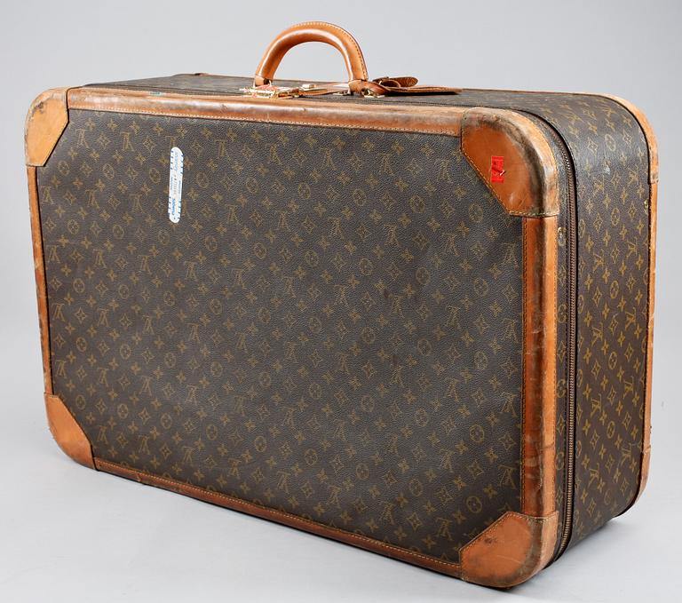 A 1980s monogram canvas suitcase by Louis Vuitton.
