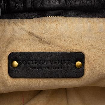 Bottega Veneta, a black intrecciato handbag.