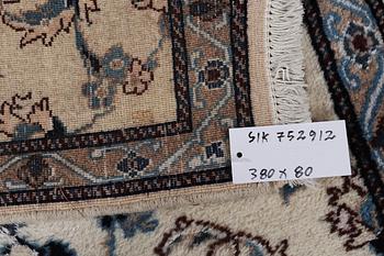 A runner carpet, Nain, part silk, 9 laa, signed, ca. 380 x 80 cm.