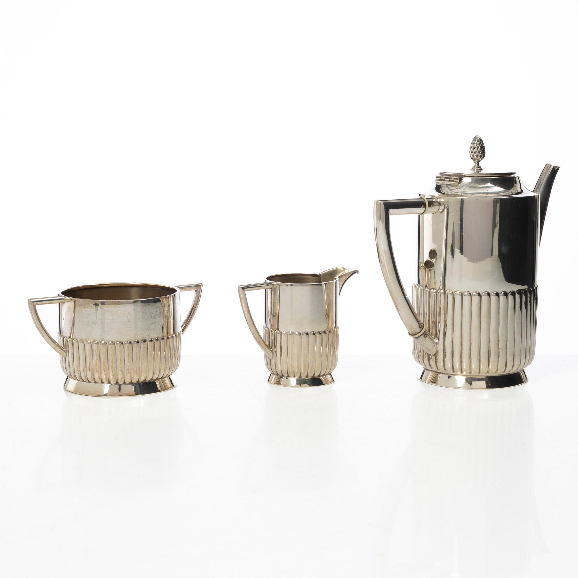 Guldsmedsaktiebolaget (GAB), A Swedish silver coffee pot, cream jug and sugar bowl, mark of GAB, Stockholm 1918-1919.