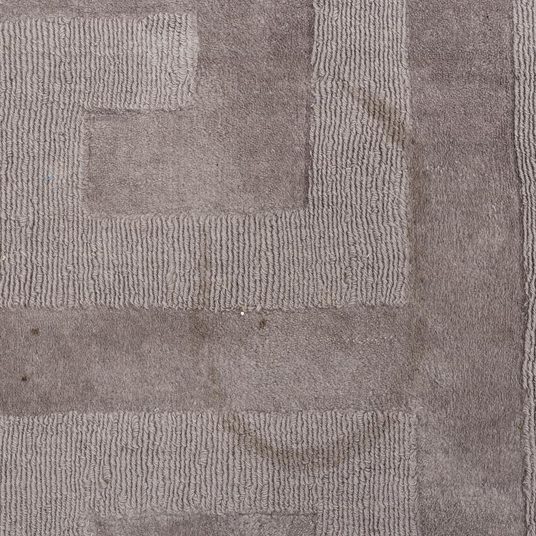 A Layered "Wool Cubes" carpet, 390x620 cm.