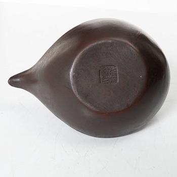 A Chinese compressed yixing teapot and cover, 20th century.
