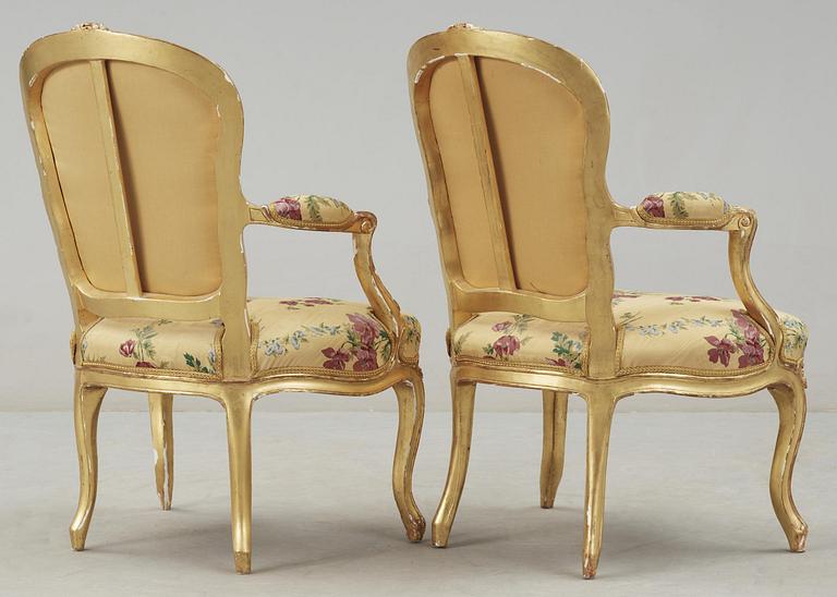 A pair of Louis XV 18th century armchairs, possibly by Claude-Etienne Michard.