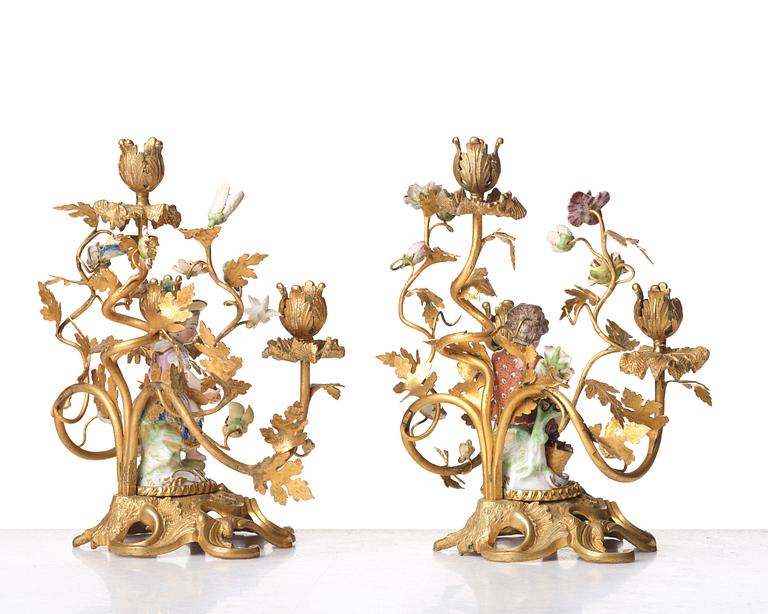 A pair of Meissen Rococo-style three-light candelabra, second half of the 1800's.