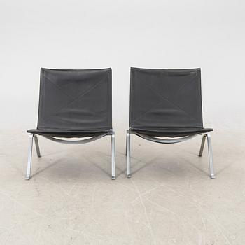 A pair of "PK22" leather armchairs by Poul Kjaerholm for E Kold Christensen, Denmark.