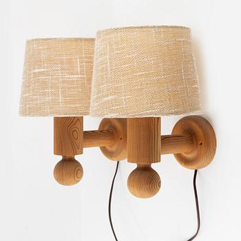 Uno & Östen Kristansson, a pair of pine wall lamps, Luxus, 1970s.