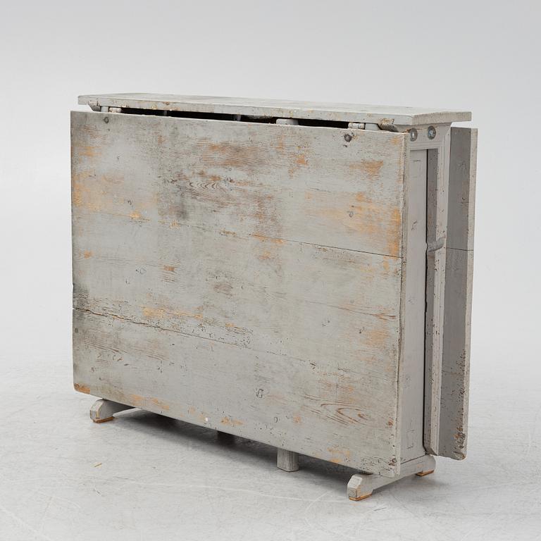 A 19th century gate-leg table.