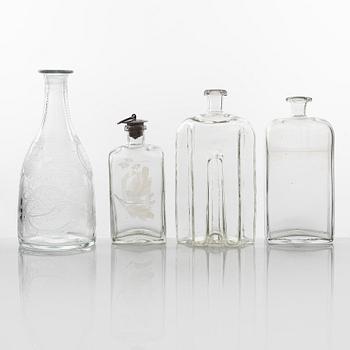 A set of three glass bottles and one decanter, 19th Century.