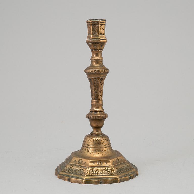 A 18th century bronze candlestick.