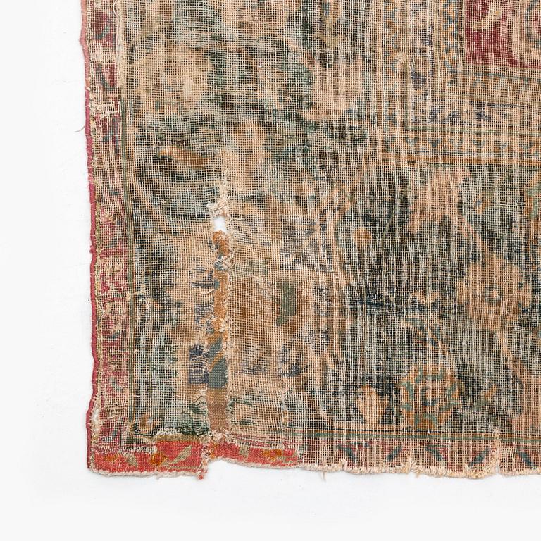 A safavid 'Spiral vine' Esfahan carpet, central persia, mid to second haft of the 17th century. Ca 562 x 231 cm.