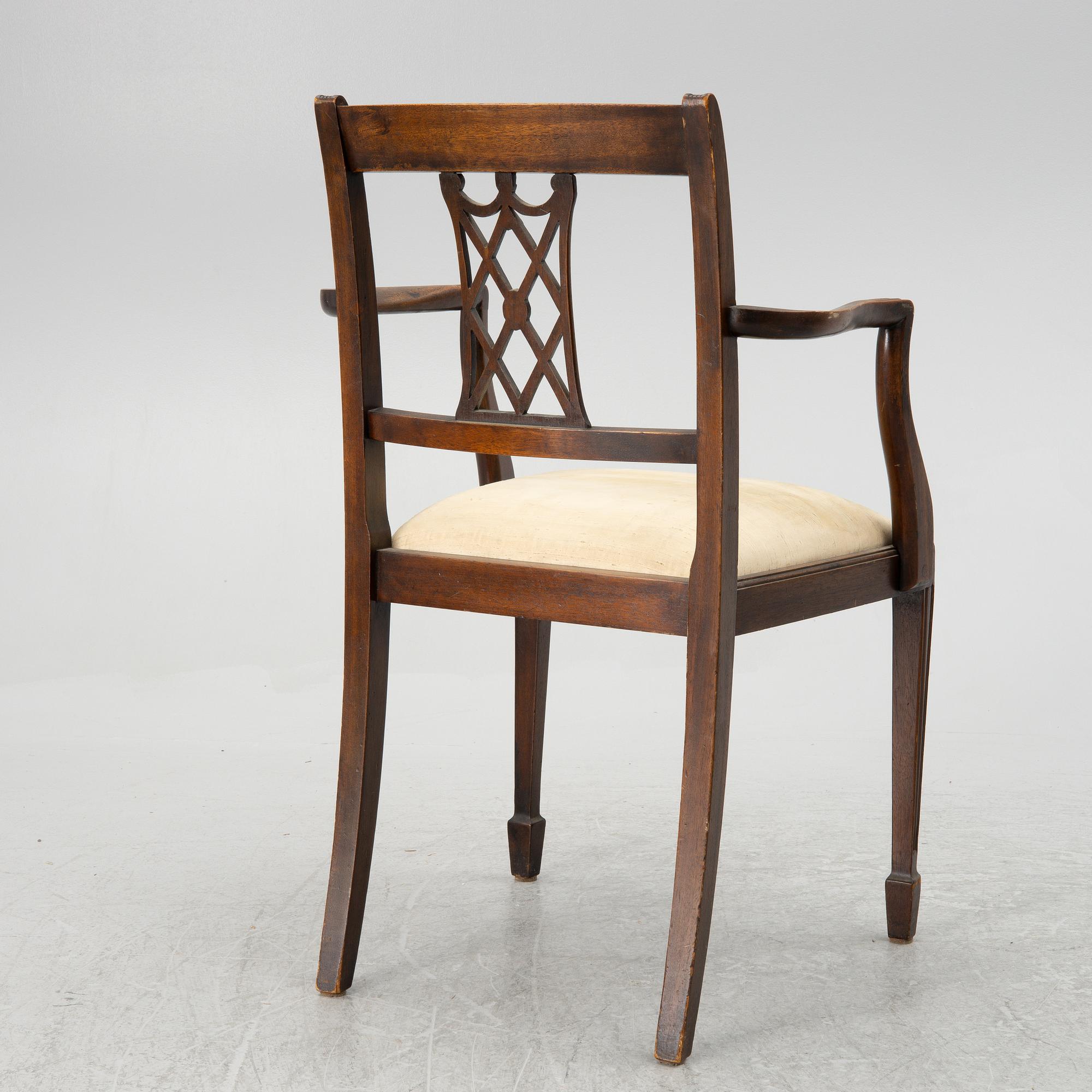 A mahogany and mahogany veneer desk with desk chair, 20th Century.