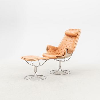 A Bruno Mathsson Jetson leather easy chair and stool later part of the 20th century.