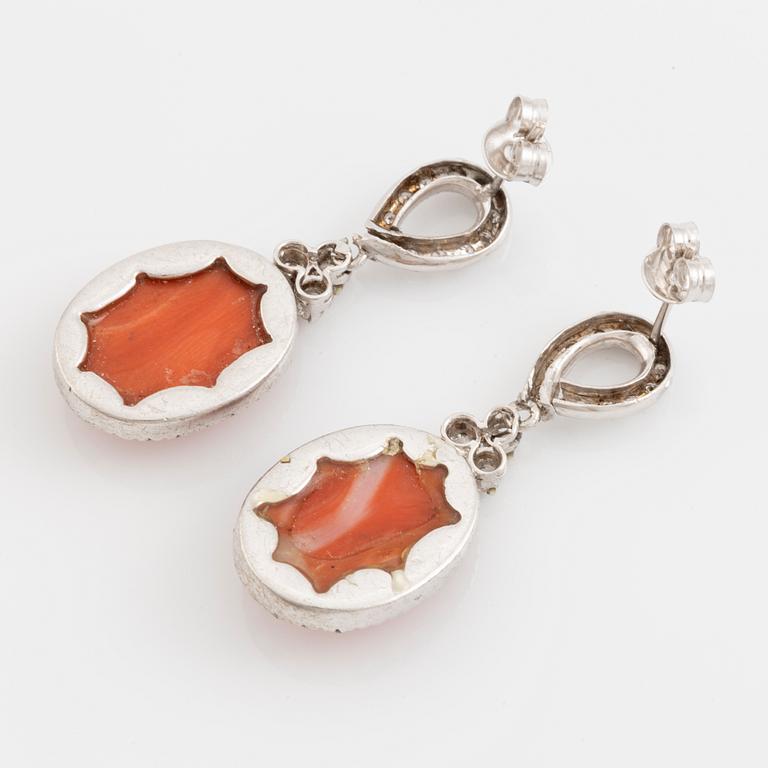 Coral and brilliant cut diamond earrings.