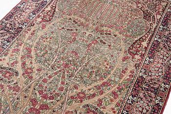 An antique Kirman rug, south Persia, c. 220 x 140 cm.